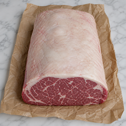 Hele graan gevoerde entrecote met dikke vetkap op bakpapier